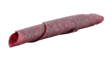 Meyve Pastila rulo tüp, şeffaf arka planda izole. Kurutulmuş meyve püresinden yapılan tatlı, sağlıklı tatlı konsepti.