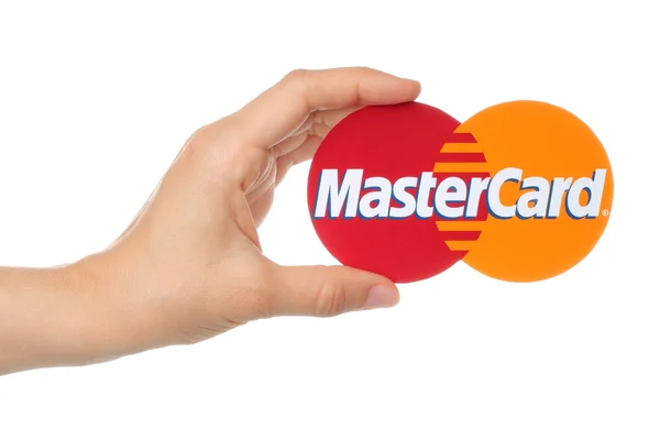 Hand holds Mastercard logo — Stock Photo, Image