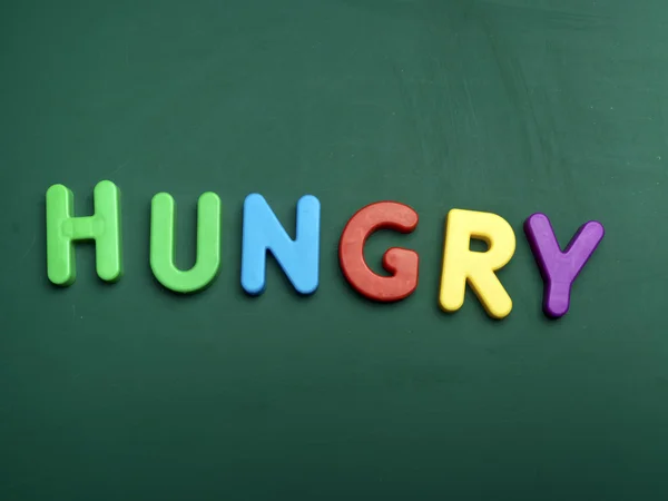 Letras concepto hambriento — Foto de Stock