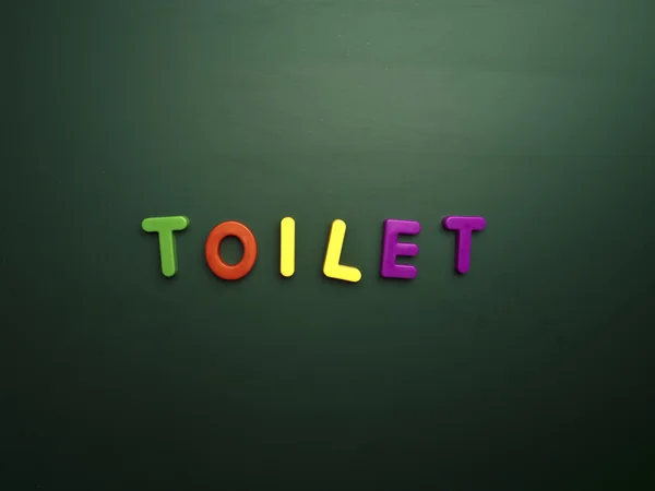 Lettere concetto di toilette — Foto Stock