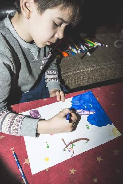 Child painting on table — Stock Photo, Image