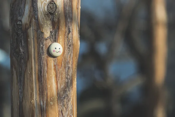 Smile icon miniature on tree — Stock Photo, Image