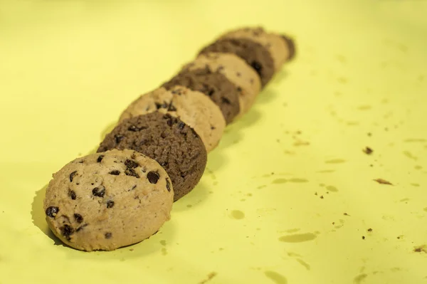 Biscuits on yellow background — Stock Photo, Image