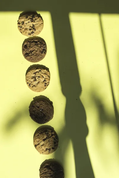 Biscuits on yellow background — Stock Photo, Image