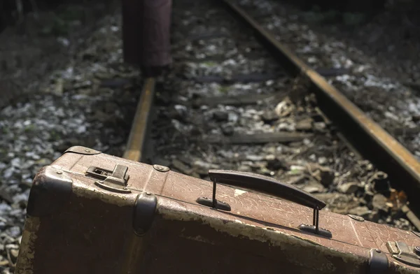 Woman and suitcase on railway road — Stock Photo, Image