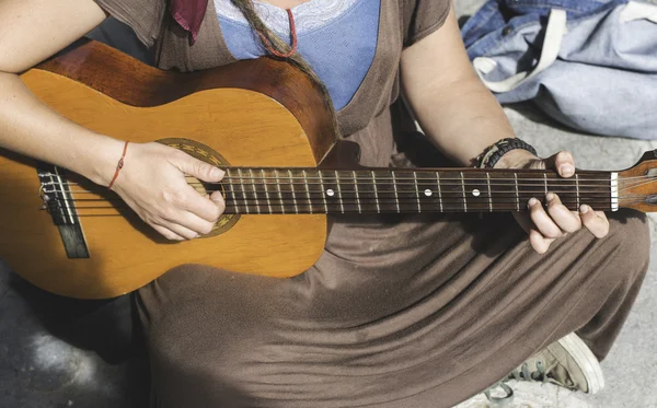 Street musician playing guitar