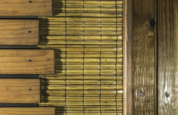 Wooden planks and cane — Stock Photo, Image