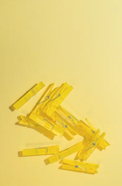 Yellow clothes pegs — Stock Photo, Image