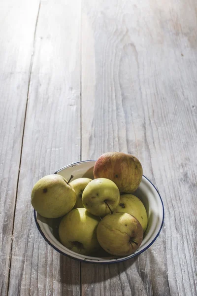 Apples in vintage metal cup — Stock Photo, Image