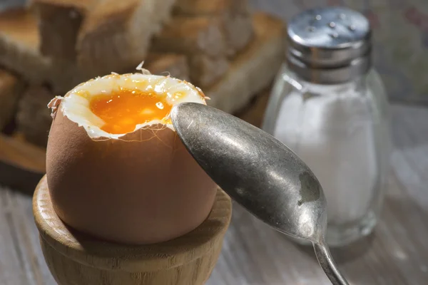 Boiled egg and vintage spoon — Stock Photo, Image