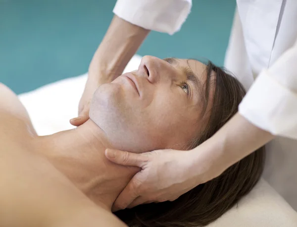 Man receiving massage relax treatment close-up from female hands — Stock Photo, Image