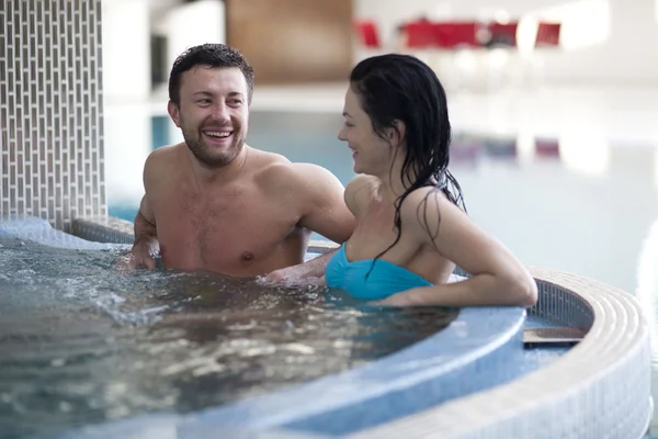 Couple relaxing in jacuzzi — Stock Photo, Image