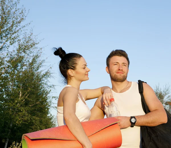 Woman and man in sports clothes — Stock Photo, Image