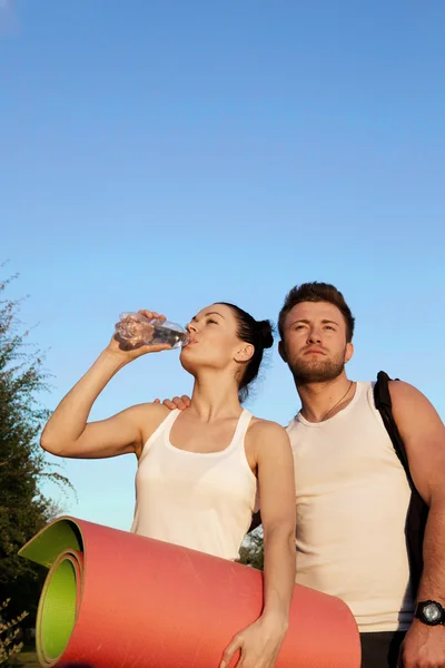 Woman and man in sports clothes — Stock Photo, Image