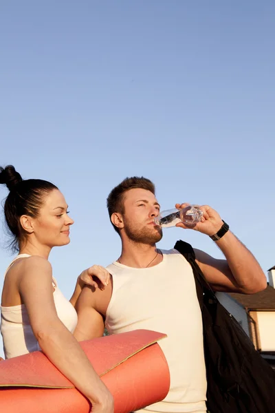 Woman and man in sports clothes — Stock Photo, Image