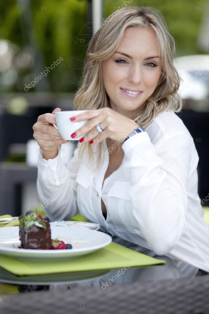 Woman at a table in a cafe