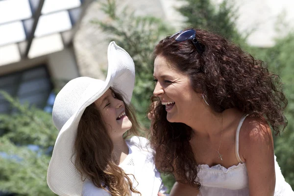 Mother and daughter smiling outdoor. — Stock Photo, Image