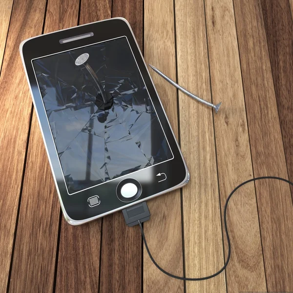 Цифровой планшет на деревянном столе с гвоздями — стоковое фото