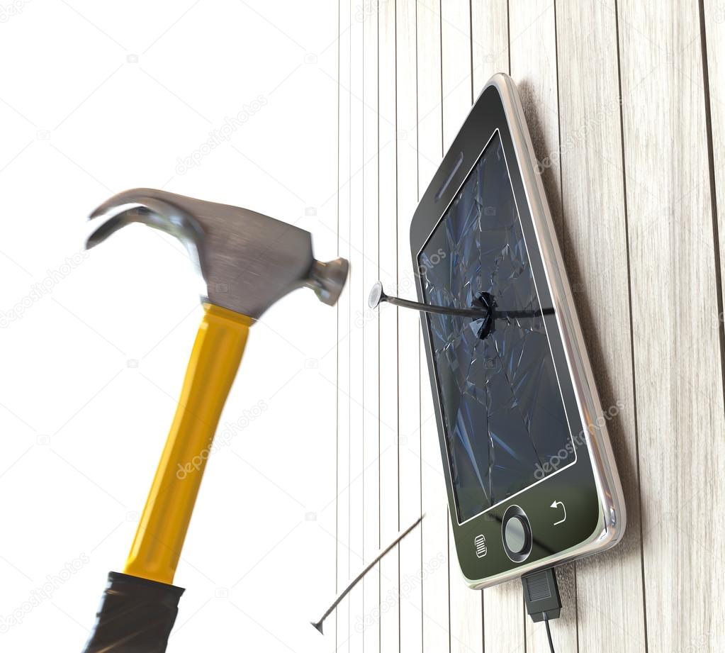Hammer and digital tablet on wooden desk with nails concept background