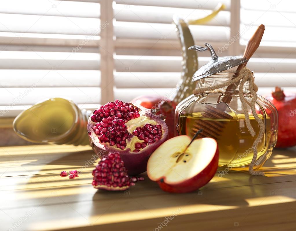 Honey jar with apples and pomegranate for Jewish New Year Holiday rosh hashanah