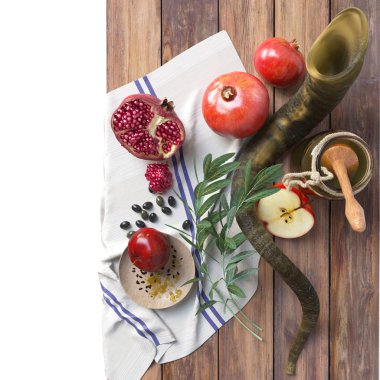 Honey jar with apples and pomegranate for Rosh Hashana religious holidayHoney jar with apples and pomegranate for Rosh Hashana religious holiday