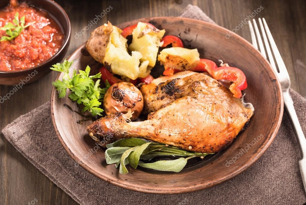 Spicy roasted chicken leg on plate — Stock Photo © yingko 87410232