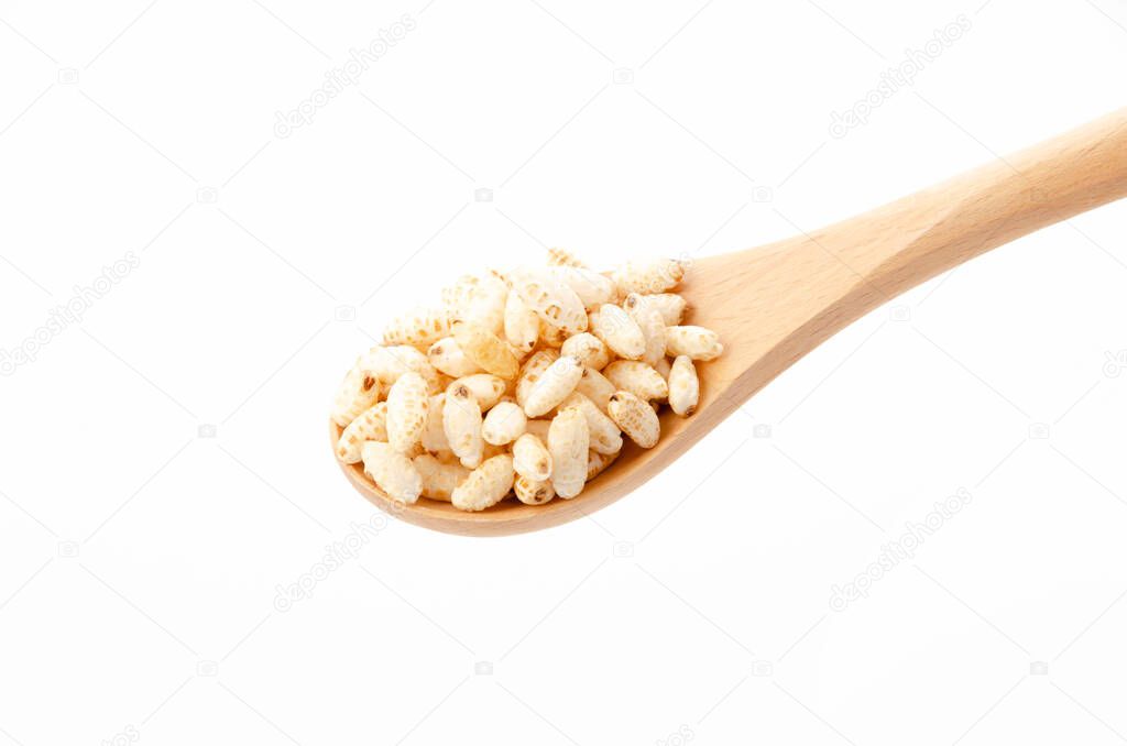 puffed rice on Wooden spoon white background