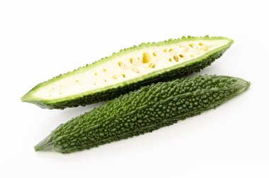 Cut half of bitter gourd on white background 