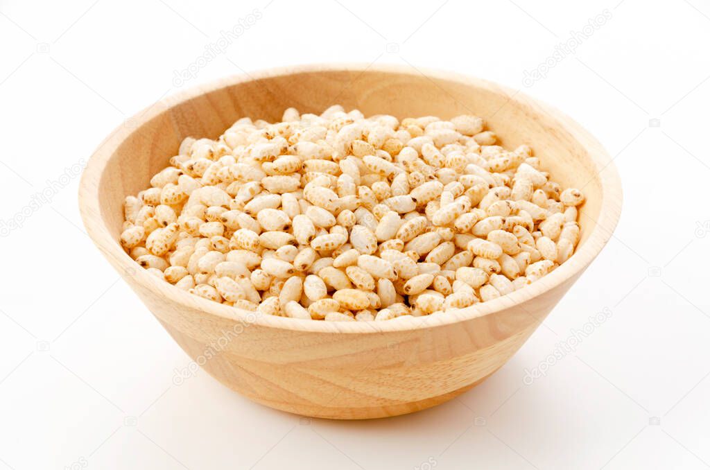 puffed rice in wooden bowl on white background