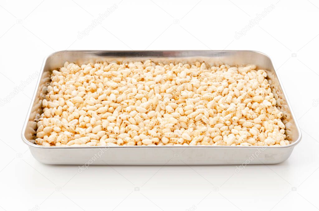 puffed rice in Aluminum tray on white background
