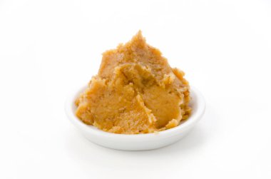 Mugi-miso, barley miso on a white plate on white background 