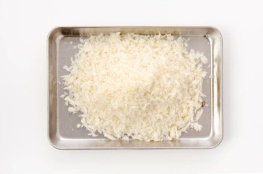 bread crumbs pile on stainless steel tray on white background.