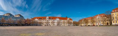 Panoramic view over major square with fountains in Magdeburg by Cathedral and Government Office, at sunny day and blue sky clipart