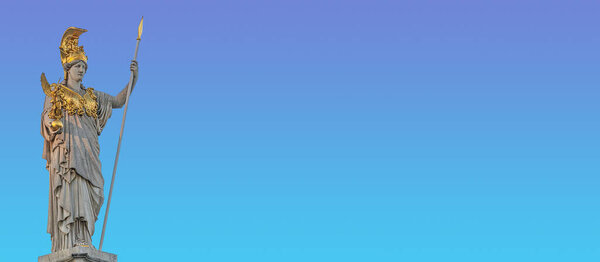 Banner with Athena statue at fountain (Pallas-Athene-Brunnen) in front of the Parliament, an ancient Greek goddess for victory and warfare at blue sky in Vienna, Austria, with copy space for text