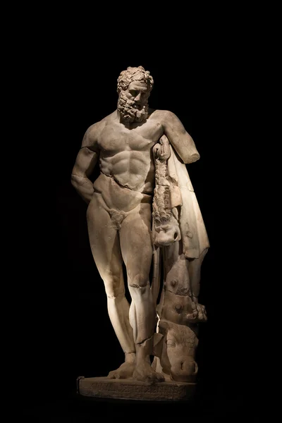 A statue of powerful Hercules, closeup, isolated in black — Stock Photo, Image