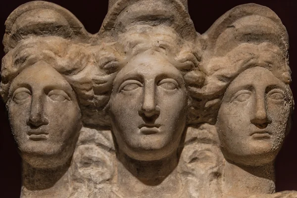 Three headed roman-asian ancient statue of beautiful women, Godd Stock Photo