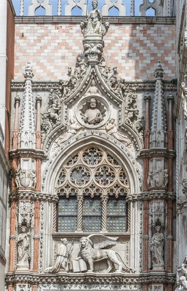 Sculpture of winged  lion of Venice with priest and book, Venice Stock Image