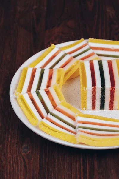 Sliced Multicolored Striped Marmalade Plate Wooden Background Colorful Jelly Candy — Stock Photo, Image