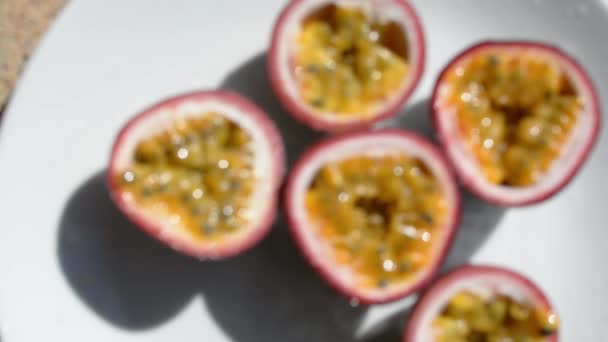 Defocused passion fruit on the table. — Stock Video