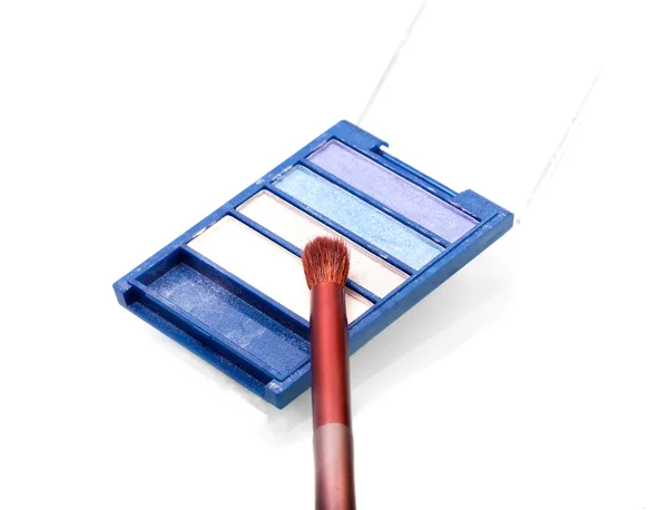 Set of blue-tint eyeshadows with a brush — Stock Photo, Image