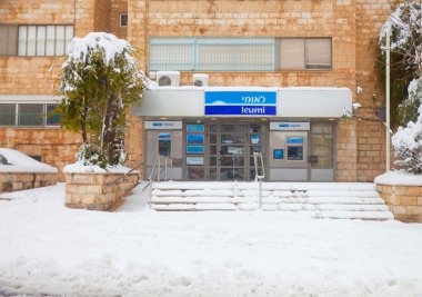 Snow-covered entrance in the Leumi Bank in Jerusalem clipart