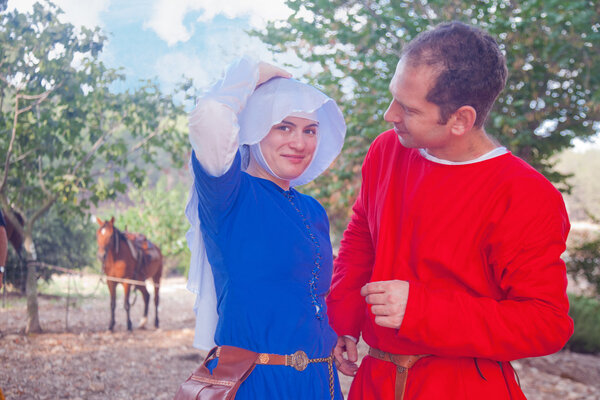Young couple costumed as medieval people