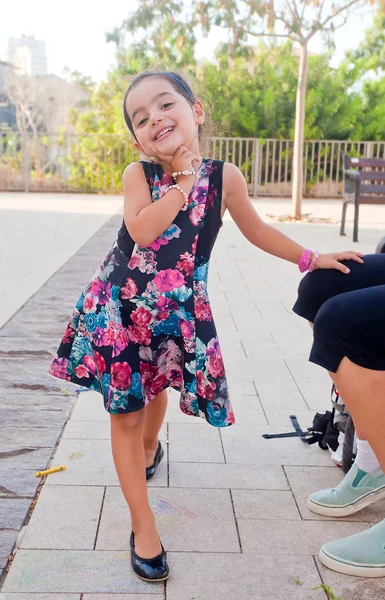 Cute little girl posing at camera — Stock Photo, Image