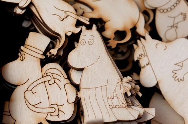 Small wooden images of the Moomims - Mumintroll - in selective focus — Stock Photo, Image