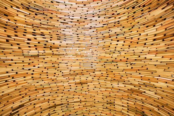 Books stacked in layers in huge tube of knowledge — Stock Photo, Image