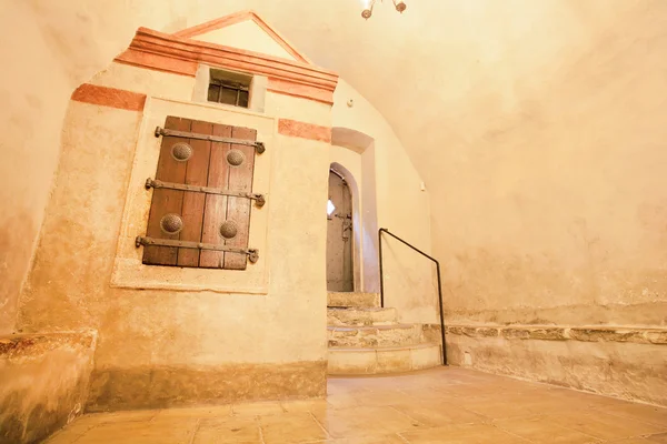 Dungeon with wrought old shutters and door — Φωτογραφία Αρχείου