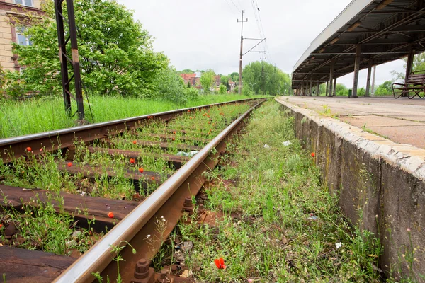 Old city railway near the historical buildings of the town — Stock Photo, Image