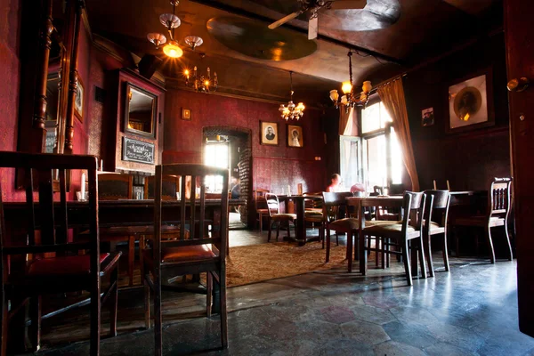 Interior of dark cafe bar with chairs — Stock Photo, Image