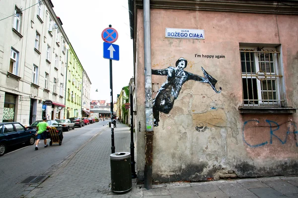 Straatkunst door onbekende kunstenaar met een gelukkig, zingen man — Stockfoto