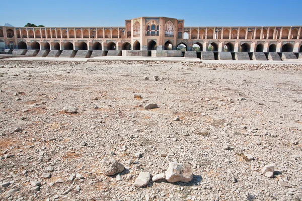 Bed of a dried river with the old bridge — Stock Photo, Image